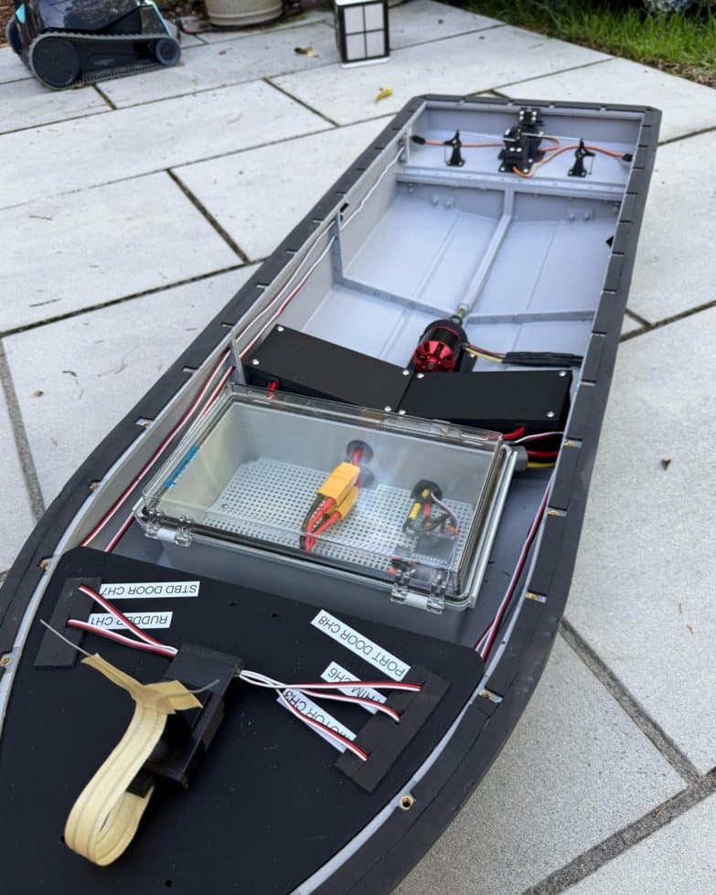 MOSAIC's hull on the dock with its sealed electronics bay open.
